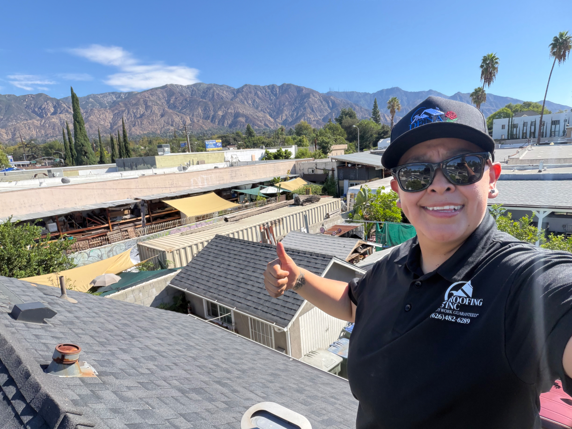Mayra Benitez, owner of Dena Roofing Pros, on a rooftop